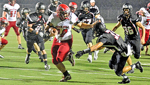 Rock Hill running back Danny Long (10) races through a big hole in the defense. Rock Hill and Chesapeake were among the early leaders of the postseason playoff computer ratings. (Robert S. Stevens & The Gold Studio of Ironton)