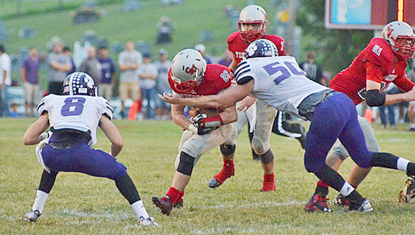 Symmes Valley Vikings’ running back Collin Webb (22) tries to run through the tackle of Chesapeake Panthers’ linebacker Brad Meadows (50) during last Friday’s game. The Vikings travel to Oak Hill this Friday in their SOC opener. (Robert S. Stevens & The Gold Studio of Ironton)