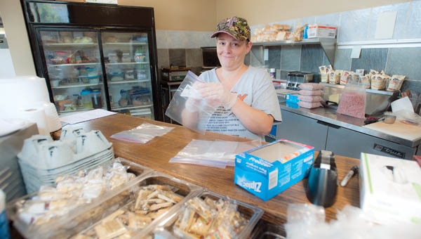 Coal Grove resident Bobbi Jones does it all during her shift at The Transit Cafe, located along South Second Street, in downtown Ironton.