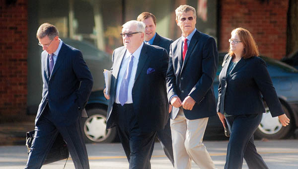 Dr. Richard Paulus and his legal team cross Greenup Avenue to the Carl Perkins Federal Building Thursday for Paulus’ arraignment.