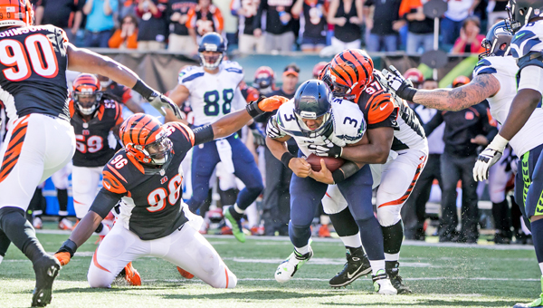 Seattle Seahawks quarterback Russell Wilson is sacked by Cincinnati Bengals’ defensive lineman Geno Atkins on third down, forcing a punt with just over two minutes remaining and the Bengals three points behind on Sunday at Paul Brown Stadium in Cincinnati. The Bengals beat the Seahawks 27-24 in overtime. (MCT Direct Photos)