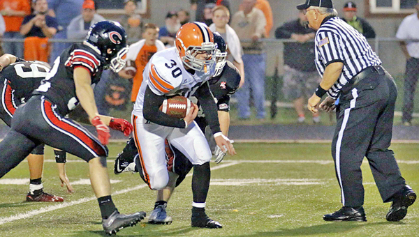 Ironton Fighting Tigers’ running back Andrew Barker (30) picks up some big yardage during the winning scoring drive in the fourth quarter on Friday. Ironton beat the Coal Grove Hornets 13-6 in an Ohio Valley Conference battle for first place. (Tim Gearhart of Tim’s News & Novelties, Park Ave. in Ironton)