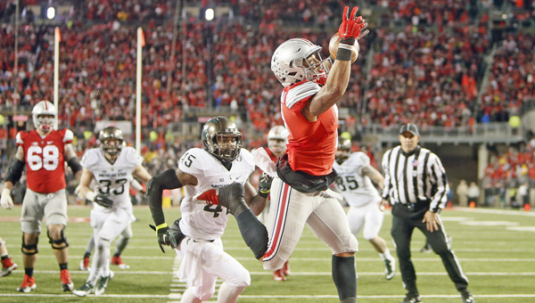 Ohio State wide receiver Jalin Marshall (7) makes a one-handed touchdown catch against Michigan State linebacker Darien Harris (45) in the second half last Saturday at Ohio Stadium. Ohio State plays at rival Michigan this Saturday. (Kyle Robertson/Columbus Dispatch/TNS/MCT Direct)