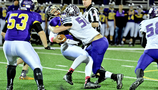 Chesapeake Panthers’ linebacker Brad Meadows (50) makes a direct hit on Lucasville Valley quarterback Bryan Rolfe during Saturday’s Division VI Region 21 quarterfinal playoff game. The Panthes fell to the Indians 23-0. (Kent Sanborn of Southern Ohio Sports Photos)