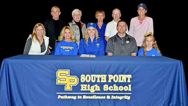 South Point Lady Pointers’ senior tennis standout Madison Riley signed a letter-of-intent on Wednesday to play at Morehead State University. Attending the ceremony were: seated from left to right, coach Julie Ditty, mother Kim Riley, Madison, father Eric Riley and sister Meredith Riley; standing from left to right, grandparents Gordon and Sandy Riley and grandparents Betty and Ron Cade, and coach Laurie Mercer. (Kent Sanborn of Southern Ohio Sports Photos)