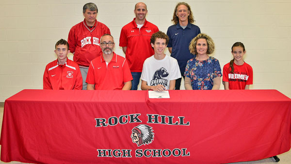 Rock Hill Redmen senior Seth Miller signed a letter-of-intent to run cross country at Shawnee State University. Attending the ceremony were: seated from left to right, brother Ethan Miller, father Mike Miller, Seth, mother Marisa Miller and sister Camryn Miller; standing from left to right, assistant Rock Hill cross country coach Dave Brammer, Rock Hill cross country head coach Mark McFann and Shawnee State head coach Eric Putnam. (Kent Sanborn of Southern Ohio Sports Photos)