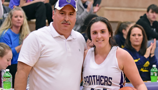 Chesapeake Lady Panthers’ senior center Kaylee Curry recorded her 1,000th career point on Wednesday. Curry needed 19 coming into the game to reach the milestone. The Lady Panthers beat South Point 61-51 to win the Lady Peake Holiday Tournament. ABOVE: Curry with her father Mark celebrate the milestone. (Kent Sanborn of Southern Ohio Sports Photos)