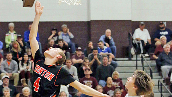 Ironton Fighting Tigers’ senior guard Phil Kratzenberg (4) drives past the Ashland Tomcats’ defense for two points. Kratzenberg scored 29 points in a 57-55 loss on Friday. (Tim Gearhart of Tim’s News & Novelties, Park Ave. in Ironton)