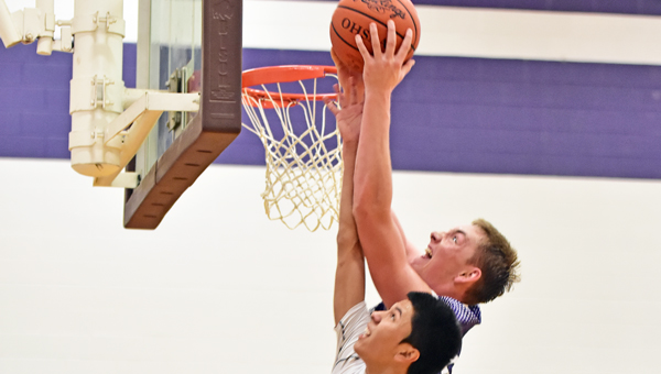 Chesapeake Panthers’ Brad Meadows grabs one of his career-high 25 rebounds during Tuesday’s 69-61 upset win over the Huntington St. Joseph Fighting Irish. (Kent Sanborn of Southern Ohio Sports Photos)