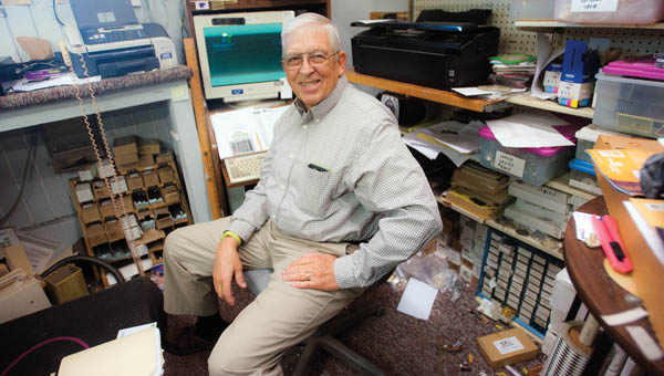 Longtime Mayor Dick Gilpin, sits inside his business, Gilpin’s Creative Trophies, as he reminisces over his terms as village mayor.