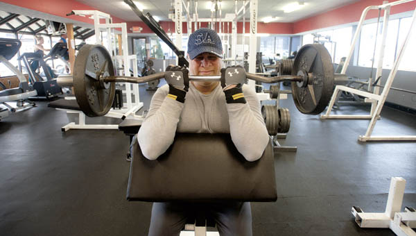 William Crockrel works out at Tri-State Rehab and Fitness, located on South Third Street, Tuesday morning.