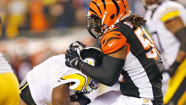 Cincinnati Bengals' linebacker Vontaze Burfict (right) makes a stop on a Pittsburgh Steelers' running back. Burfict's 15-yard personal foul helped set up the Steelers' winning field goal on Saturday in the NFL Wild Card playoff game. (Courtesy of The CIncinnati Bengals.com)