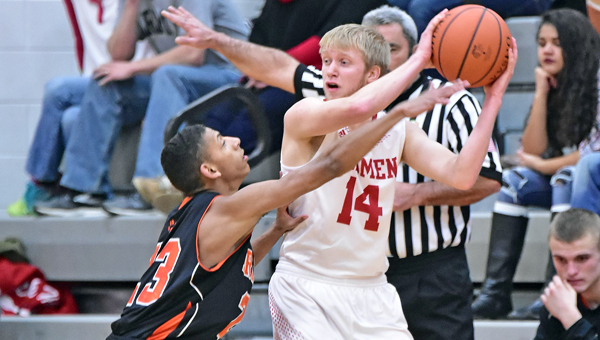 Ironton Fighting Tigers’ Marques Davis (23) applies defensive pressure while Rock Hill’s Nathan Turvey looks to make a pass to a teammate. Ironton beat the Redmen 47-35 on Tuesday. (Kent Sanborn of Southern Ohio Sports Photos)