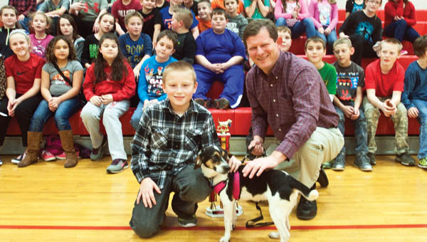 Symmes Valley Elementary School student Isaac Callicoat poses with his dog, Lady, and Lawrence County Auditor Jason Stephens after being presented Top Dog winner of 2016.