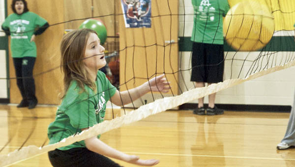 Noah Marcum returns a serve during a game of volleyball as part of a special athletic event at Fairland West.