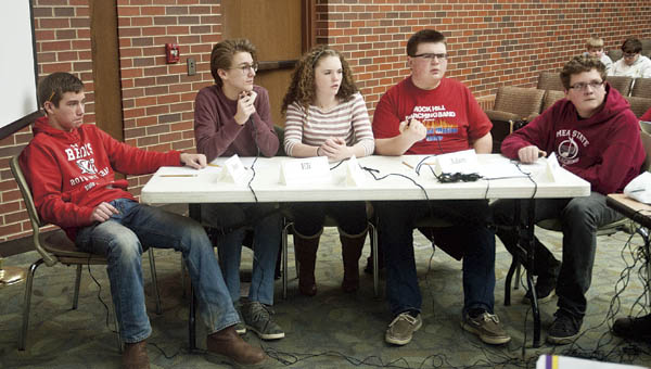Rock Hill students, from left to right, Brady Floyd, Eli Baker, Lucy Simpson, Adam Fleeman and Jacob Gnau listen as the pronouncer reads off questions in the final rounds against Symmes Valley during the Lawrence County Middle School Quiz Bowl Tournament Tuesday at Ohio University Southern.