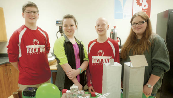 Tucker Meadows, Katie Tennison, Nathan Wroblewski and Olivia Edwards pose with their concept model for the city of the future as part of Project Lead the Way.