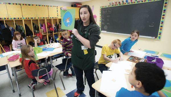 Kelli Harrah, with the Huntington Museum of Art, instructs students from Burlington Elementary School during a special art presentation Wednesday.