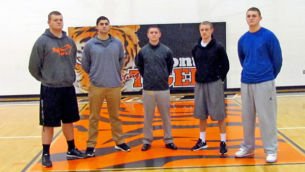 Basketball has been a family affair for the Ironton Fighting Tigers this season. From left to right are cousins Tyler Webb, Kyle Bryant, assistant coach Chase Kratzenberg, Phil Kratzenberg and Ryan Bryant. All five are out of the Bob Kratzenberg family tree. (Tony Shotsky of Southern Ohio Sports Photos)