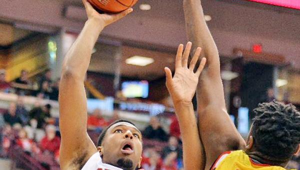 Tevor Thompson (32) of the Ohio State Buckeyes puts up a shot over Diamond Stone (33) of the Maryland Terrapins in the second half on Sunday at Value City Arena in Columbus. Maryland defeated Ohio State 66-61. (Photo by Jamie Sabau/Getty Images)