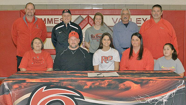 Symmes Valley Lady Vikings’ senior softball standout Kaitlyn Payne signed a letter-of-intent with the University of Rio Grande on Thursday. Attending the ceremony were: seated from left to right, grandmother Dolly Payne, father Shannon Payne, Kaitlyn, mother Erin Payne and sister Kailee Payne; standing left to right, coach Rusty Webb, Rio Grande head coach Chris Hammond, Rio Grande assistant Kaylee Walk, Lady Vikings’ assistant Chuck Renfroe and Vikings’ head coach Jeff “Odie Estep. (Robert S. Stevens & The Gold Studio Of Ironton)