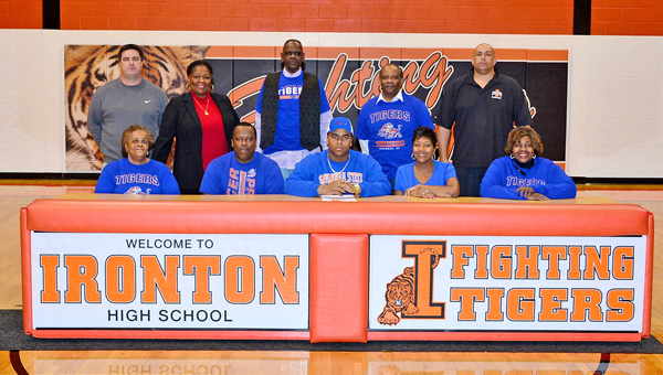 Ironton Fighting Tigers’ senior All-Ohio football standout Desmond Young signed a letter-of-intent to play at Savannah State University in Georgia. Attending the celebration on Thursday were: seated from left to right, Loretta Vinson, father Joe Young, Desmond Young, mother Anissa Young and Rena Cosby; standing from left to right, Ironton head coach Mark Vass, Darlene Ingram, George Cosby, Leonard Irvin and Ironton atheltic director Mark LaFon. (Kent Sanborn of Southern Ohio Sports Photos)