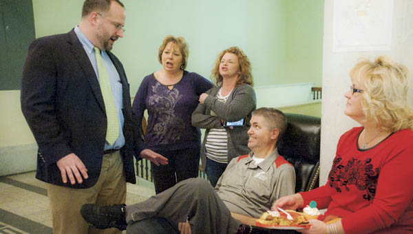 Assistant prosecuting attorney Mike Gleichauf gets everyone to sing “Happy Birthday” in honor of Judge D. Scott Bowling’s birthday celebration on Wednesday at the Lawrence County Courthouse.