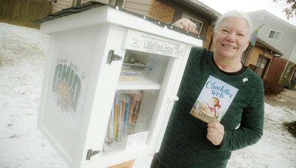 Lois Terkhorn displays her Little Free Library, located on Kevin Street, on the north end of Ironton.