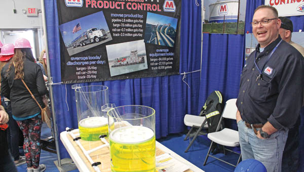 Catlettsburg Marathon Petroleum refinery training specialist Paul Day at the refinery’s career day product control station. The station explained the refinery’s storage tanks.