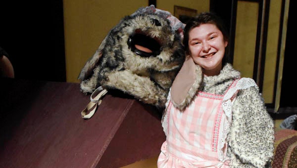 Ironton High School student Hannah Tussey stands next to her doghouse and in character as Nana in the production of Peter Pan at the Paramount Arts Center.