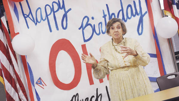 Hanging Rock president Jean Butler acts the role of Ohio's original First Lady Mary Tiffin during a special performance at Fairland West in recognition of Ohio's birthday.