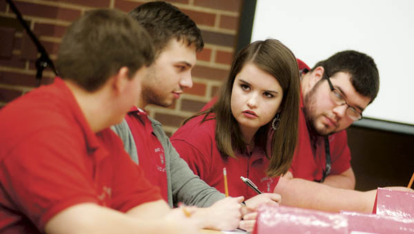 Pictured left to right, Colin Lybrand, Tanner Shephard, Felicity Jenkins and Nic Slack, of Symmes Valley High School, contemplate an answer.