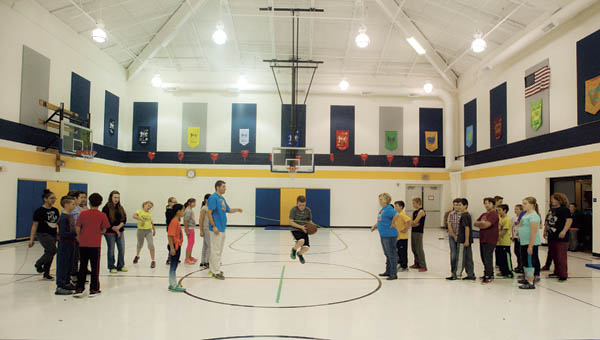 Fifth grade students from Burlington Elementary School take turns jumping rope during the annual Jump Rope for Heart event Friday.