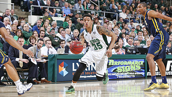 Ohio Bobcats guard Jordan Dartis (35) takes the ball up the court against UNC-Greensboro during Monday’s CBI Tournament at Ohio University’s Convocation Center. The Bobcats rallied in the second half to win 72-67 and will play in the semifinals against Morehead State. (Calvin Mattheis/Ohio University Athletics)
