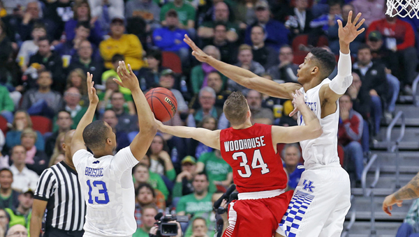 Kentucky's Skal Labissiere (1) blocks a shot by Stony Brook's Lucas Woodhouse (34) during the first half in the first round of the NCAA Tournament at the Wells Fargo Arena in Des Moines, Iowa, on Thursday. Kentucky advanced, 85-57 and will play Indiana at 5:15 p.m. on Saturday. (Charles Bertram/Lexington Herald-Leader/TNS)