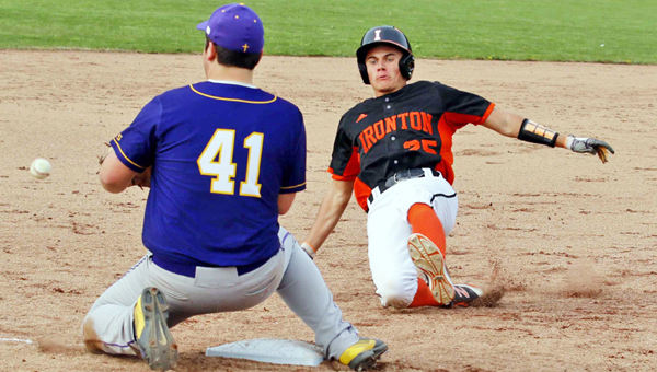 Ironton FIghting TIgers’ Dane Wilson (25) slides safely into third base with a triple during Wednesday’s game. Wilson went 3-for-3 with four runs batted in as Ironton downed the St. Joseph Flyers 12-2. (Tim Gearhart of Tim’s News & Novelties, Park Ave. in Ironton)