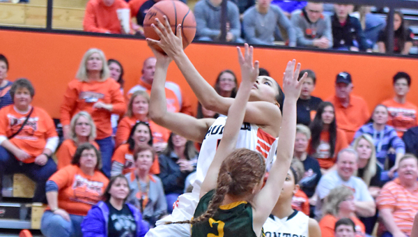 Ironton Lady Fighting Tigers’ sophomore guard Lexie Wise (with ball) makes a driving layup to start the fourth quarter during Saturday’s 49-36 win over North Adams in the Division III district championship game. Ironton plays Alexander at 6:15 p.m. on Wednesday at Logan High School. (Kent Sanborn of Southern Ohio Sports Photos)