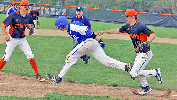 Ironton Fighting Tigers’ pitcher Garrett Carrico (13) tags out a Gallipolis runner during a rundown in Friday’s Ohio Valley Conference game. The game was suspended after seven innings due to darkness with the score tied 5-5. (Tim Gearhart of Tim’s News & Novelties, Park Ave. in Ironton)