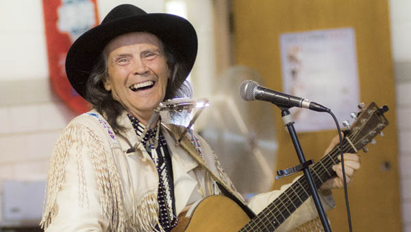 Artist Steve Free performs for students Tuesday at St. Lawrence School in Ironton. Free has performed all over the United States and Canada and has been featured on PBS, TNN and NPR.
