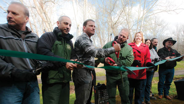 Community members gather for a ribbon cutting ceremony of the new Balancing Rock Trail Friday morning at Lake Vesuvius.