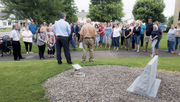 Randy Thompson, right, and Terry Porter, right, address members of Lawrence County Department of Jobs and Family Services during their memorial unveiling Thursday. The memorial shows the names of those employees they lost.