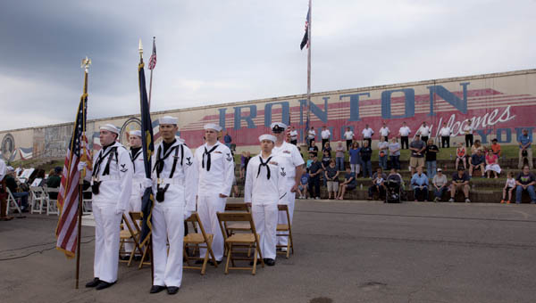Members of the United States Navy along with area residents are at attention during the annual Navy Night Memorial service in downtown Ironton Thursday.