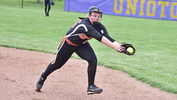 Ironton Lady Fighting Tigers’ shortstop Shay Cox stretches to make the catch of line drive during Tuesday’s Division III district semifinal game. Ironton gave up seven unearned runs in an 8-3 loss to the Alexander Lady Spartans. (Kent Sanborn of Southern Ohio Sports Photos)