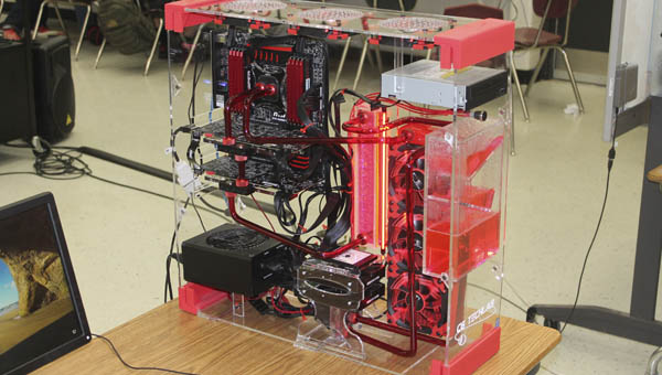 A computer case, designed and built by Dawson-Bryant High School computer tech students, houses a student-built liquid cooling super computer in the school’s tech lab.