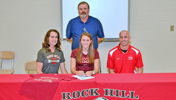 Rock Hill Redwomen senior cross country standout Sarah McFann signed a letter-of-intent with Maryville (TN.) College on Thursday. Attending the ceremony were: seated left to rigth, mother Beth, Sarah, father and coach Mark McFann; standing is athletic director Barry Litteral. (Kent Sanborn of Southern Ohio Sports Photos)