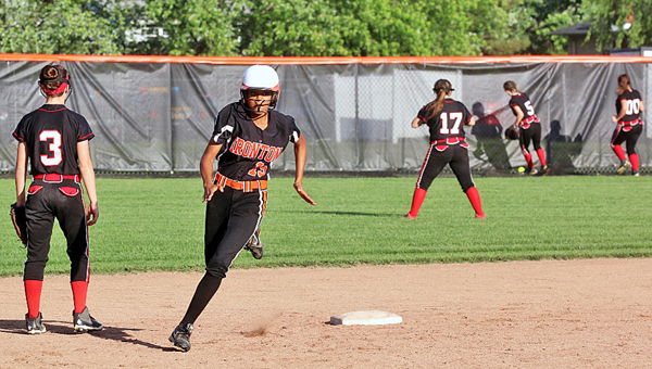 Ironton Lady Fighting Tigers’ Zjaytayia Mize (15) rounds second base en route to hitting an inside-the-park home run during Friday’s Division III sectional tournament championship game. Ironton outscored the Coal Grove Lady Hornets 14-10. (Tim Gearhart of Tim’s News & Novelties, Park Ave. in Ironton)