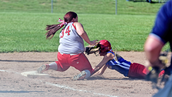 Symmes Valley Lady Vikings’ Hannah Newcomb (34) tags out a Peebles’ baserunner during Thursday’s Division IV district semifinal tournament game. The Lady Vikings won 5-0 and play Portsmouth Clay at 1 p.m. on Saturday in the district championship game at Minford High School. (Kent Sanborn of Southern Ohio Sports Photos)
