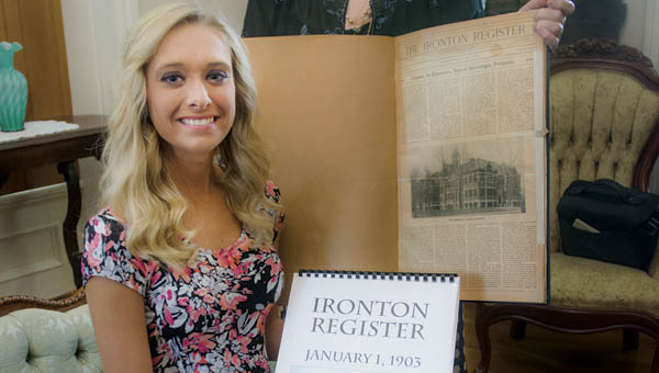 Rock Hill High School senior Shelby Dalton and Kay Radar, with the Lawrence County Historical Museum, displaying copies of Ironton Register and the original Ironton Register.