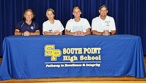 South Point Pointers’ senior track standout Stephen Wagoner signed a letter-of-intent on Tuesday with the Shawnee State University Bears. Attending the ceremony were: from left to right, Shawnee State head coach Eric Putnam, mother Ann Clay, Stephen and Pointers’ head coach Todd Wells. (Kent Sanborn of Southern Ohio Sports Photos)