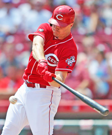 Cincinnati Reds’ first baseman Jay Bruce connects for an RBI single in the third inning on Sunday against the Arizona Diamondbacks. The Reds lost a 9-8 slugfest to the Diamondbacks. (Courtesy of The Cincinnati Reds.com/Aaron Doster — The Associated Press)